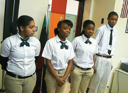 (Left) A student at Catalyst Howland explains a lesson plan to Alderman Chandler. (Above) Catalyst Howland School students Veranika McGhee, Jenna LeSure, Eryielle Barrow, Jamaurion Leverston greet visitors, including local pastors and political leaders during a “Bring Your Alderman to School Day. (Left) A student at Catalyst Howland explains a lesson plan to Alderman Chandler. (Above) Catalyst Howland School students Veranika McGhee, Jenna LeSure, Eryielle Barrow, Jamaurion Leverston greet visitors, including local pastors and political leaders during a “Bring Your Alderman to School Day.